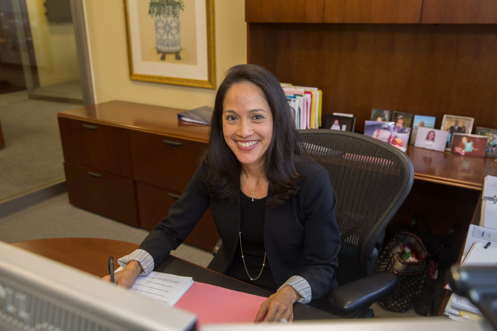 CEO Renée Kwok at her desk at 260 Franklin Street.