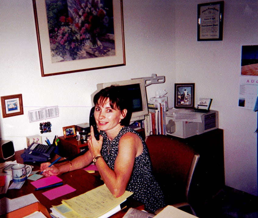 Connie Wyllie, who joined TFC in 1985 and now serves as Chief Compliance Officer, at her desk at 176 Federal Street.